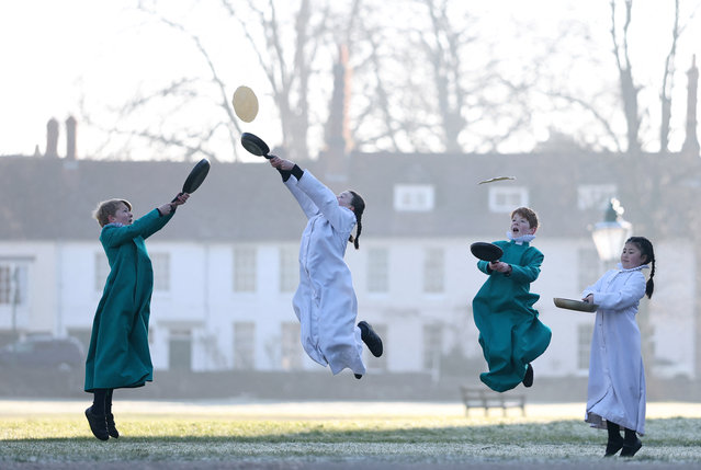 Probationer choristers of Salisbury Cathedral Choir practice flipping pancakes ahead of Shrove Tuesday at Salisbury Cathedral, Salisbury, Britain, on March 3, 2025. (Photo by Toby Melville/Reuters)