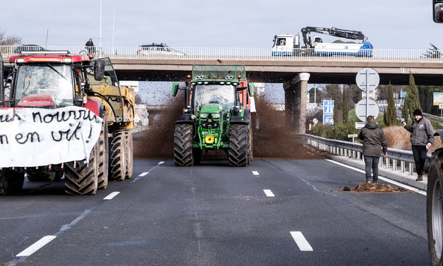 French farmers from various unions (FDSEA, JA) blocked the M6 and A6 motorways in Lyon, France on January 25, 2024. Lanes are blocked in both directions from Limonest (69). This blockade is part of a nationwide action of roadblocks organized by several agricultural unions to protest against rising production costs and environmental regulations. The European Commission is due to begin “strategic” discussions on Thursday with farmers' federations, agri-businesses, NGOs and experts on ways to quell farm anger in several countries. (Photo by Konrad K/SIPA Press/Rex Features/Shutterstock)