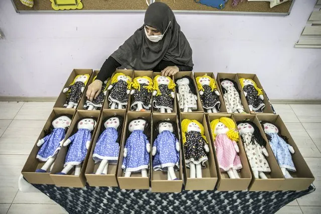 Women sew knitted toys as a gift for Syrian orphan children living in Turkey and in the refugee camps in Syria as part of a project launched within the Orphan Foundation, Reyhanlı Education Village, in Hatay, Turkey on June 11, 2020. (Photo by Cem Genco/Anadolu Agency via Getty Images)