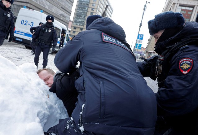 Police officers detain a man during a gathering in memory of Russian opposition leader Alexei Navalny near the Wall of Grief monument to the victims of political repressions in Moscow, Russia on February 17, 2024. (Photo by Reuters/Stringer)