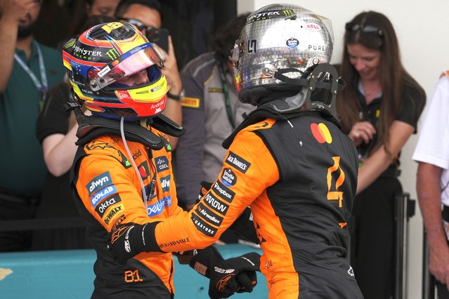 McLaren drivers Oscar Piastri of Australia, left, and Lando Norris of Britain celebrate after a first and second place finish in the Formula One Miami Grand Prix auto race Sunday, May 4, 2025, in Miami Gardens. Fla. (Photo by Rebecca Blackwell/AP Photo)