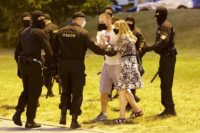 Police detain protesters after the Belarusian presidential election in Minsk, Belarus, Sunday, August 9, 2020. (Photo by Sergei Grits/AP Photo)