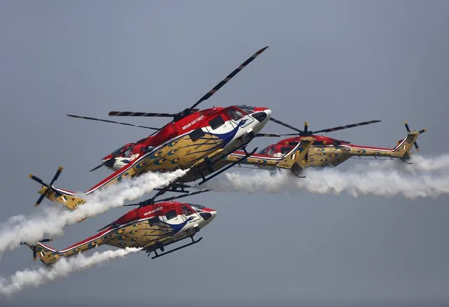 Indian Air Force "Sarang" helicopters perform during the full-dress rehearsal for Indian Air Force Day at the Hindon air force station on the outskirts of New Delhi October 6, 2015. The Indian Air Force will celebrate its 83rd anniversary on October 8. (Photo by Anindito Mukherjee/Reuters)