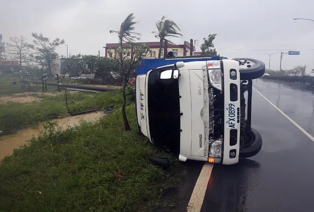 A truck is blown down by strong winds as Typhoon Meranti hits Taiwan, southeast China, September 14, 2016. (Photo by Xinhua/Barcroft Images)