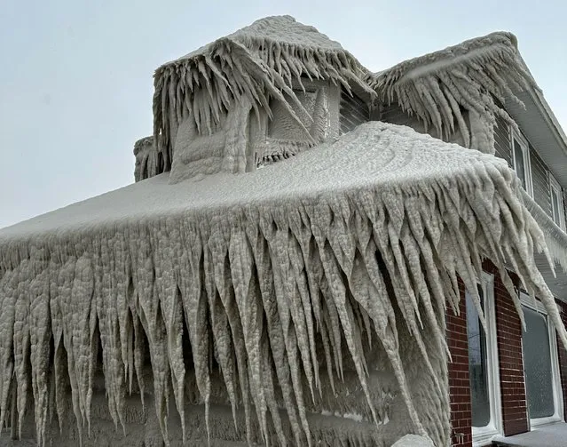 Hoak's restaurant is covered in ice from the spray of Lake Erie waves during a winter storm that hit the Buffalo region in Hamburg, New York on December 24, 2022. (Photo by Kevin Hoak via Reuters)