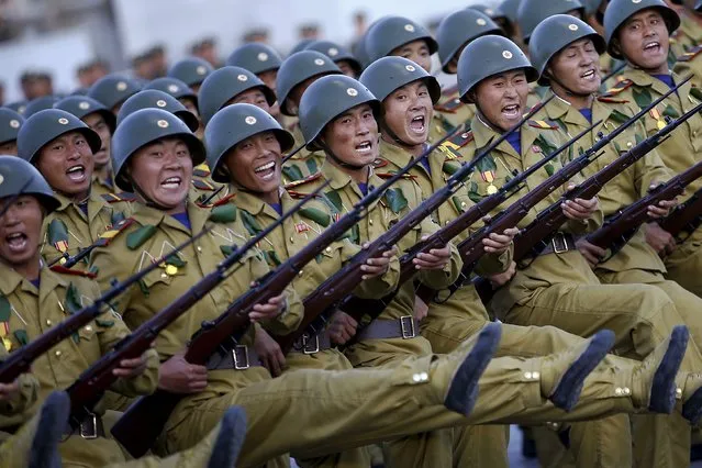 Soldiers shout slogans as they march past a stand with North Korean leader Kim Jong Un during the parade celebrating the 70th anniversary of the founding of the ruling Workers' Party of Korea, in Pyongyang October 10, 2015. (Photo by Damir Sagolj/Reuters)