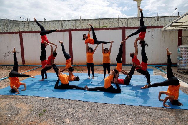Thai female prisoners practice yoga at Ratchaburi Central Prison in Ratchaburi province, Thailand, 28 August 2020. The Yoga Prison project is part of Thailand's Department of Corrections rehabilitation program introduced at the Ratchaburi Central Prison in 2012 before expanding to several prisons across Thailand offering people behind bars practicing yoga aimed to encourage and promote good health with physical and mental strength. The Yoga Prison project has been reported to help prisoners with concentration on body and mind relaxation as well as reducing inmates stress and anxiety. (Photo by Rungroj Yongrit/EPA/EFE)