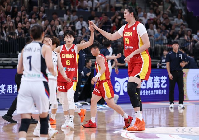 Zhang Ziyu (1st R) celebrates with teammate Yang Shuyu (3rd R) during the Group A match between China and South Korea at the FIBA Women's Asia Cup Division A 2025 in Shenzhen, south China's Guangdong Province, July 15, 2025. (Photo by Mao Siqian/Xinhua/Alamy Live News)