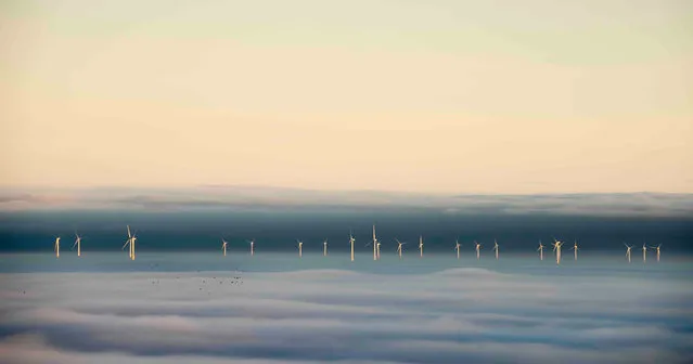 When the Fog Parted, north Wales coast. Changing Landscapes special award winner. “The blanket of fog over the Irish Sea parted revealing the line of wind turbines off the north Wales coast. Tiny black dots appeared as a flock of migrating birds flew past over the fog. Do they know the way, or has the gap in the fog helped them?”. (Photo by Graham Eaton/UK Landscape Photographer of the Year 2020)