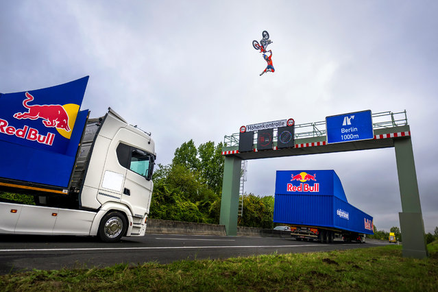 How it worked, according to Red Bull: each lorry was 23 metres apart and moving at 12mph. Luc Ackerman accelerated his bike to 34mph — without using a speedometer — and cleared 40 metres of total distance to land on the other truck in Aldenhoven, Germany on August 2, 2025. (Photo by Joerg Mitter/Red Bull Content Pool)
