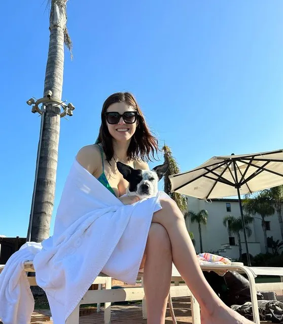 American actress Alexandra Daddario dries off with her dog in the second decade of April 2023. (Photo by alexandradaddario/Instagram)