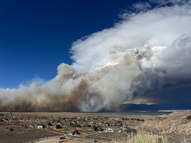 This image released by the Mammoth Lakes Police Department shows the Pack Fire burning on Thursday, November 13, 2025, in Mono County, Calif. (Photo by Mammoth Lakes Police Department via AP Photo)