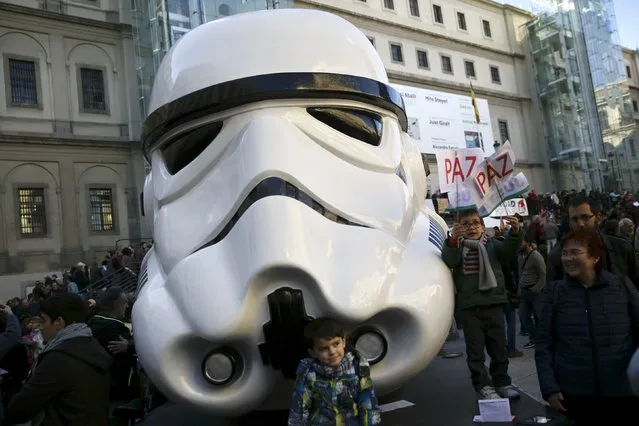 Children play next to a Star Wars themed sculpture during a protest against militant attacks and war, in Madrid, Spain, November 28, 2015. (Photo by Andrea Comas/Reuters)