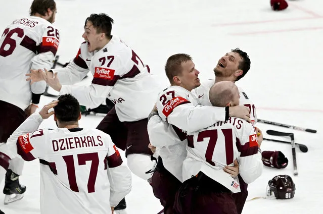 Latvia players celebrate after winning bronze during United States v Latvia in IIHF World Ice Hockey Championship 2023 at Nokia Arena in Tampere, Finland on May 28, 2023. (Photo by Jussi Nukari/Lehtikuva via Reuters)