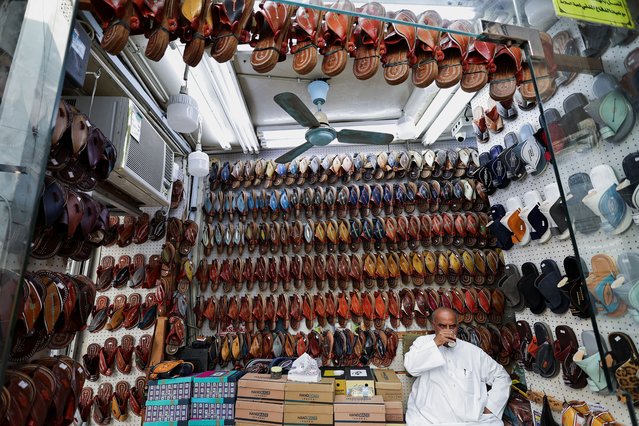 An owner of a traditional sandal shop takes his afternoon tea in the historic old city knows as “Al-Balad” in Jeddah, Saudi Arabia, on April 21, 2025. (Photo by Hamad I Mohammed/Reuters)