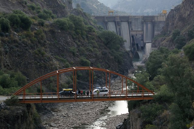 August 11, 2012 – Lima, Peru – Bridge over the Rio Mantaro below Represa Tablachaca (Tablachaca Dam) while on scouting trip of the Rio Mantaro downstream from Huancayo. The expedition team was concerned about the amount of water flow below the dam during the dry season. There was just enough flow to paddle and drag the kayaks until the Rio Mantaro reached the confluence of the Rio Huarpa. (Photo by Erich Schlegel/zReportage via ZUMA Press)