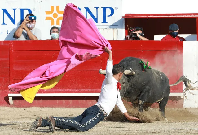 Gerardo Rivera, fights his first bull of the afternoon named “Reencuentro”, 465kg, in the La Luz de Leon bullring, in Leon, Guanajuato, Mexico, 17 April 2021. (Photo by Luis Ramirez/EPA/EFE)