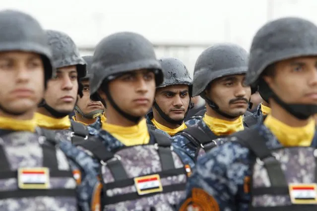 Troops of the Interior Ministry take part in a ceremony marking the Iraqi Police Day at a police academy in Baghdad January 9, 2016. (Photo by Khalid al Mousily/Reuters)