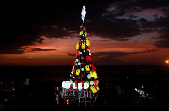 An illuminated Christmas tree is seen at a park in Pasay city, Metro Manila, Philippines December 24, 2016. (Photo by Czar Dancel/Reuters)