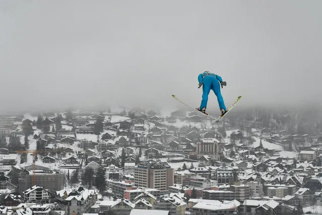 France's Jonathan Learoyd soars through the air during the men's FIS Ski Jumping World Cup competition in Engelberg, central Switzerland, on December 16, 2018. (Photo by Fabrice Coffrini/AFP Photo)