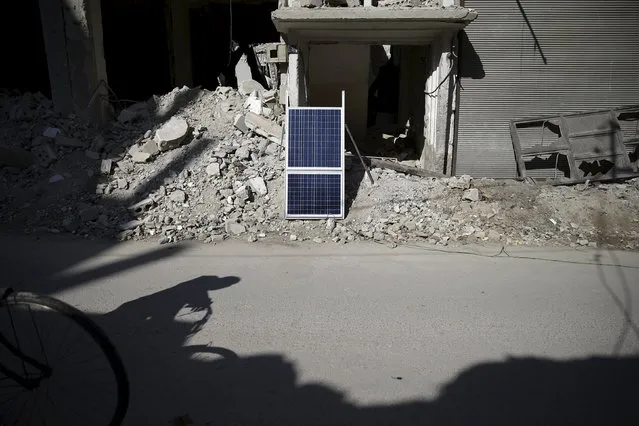 A solar panel is placed on rubble along a street in the Douma neighbourhood of Damascus, Syria February 9, 2016. (Photo by Bassam Khabieh/Reuters)