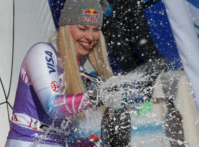 Lindsey Vonn celebrates on the podium after the women's downhill at the Alpine Skiing World Cup in Cortina d'Ampezzo, Italy, January 20, 2018. (Photo by Stefano Rellandini/Reuters)