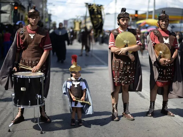 Catholics participate in the “Santo Entierro” (Holy Burial) procession during Good Friday, as part of Holy Week celebrations in Guatemala City, on April 3, 2015. Christians around the world are marking the Holy Week, commemorating the crucifixion of Jesus Christ, leading up to his resurrection on Easter. (Photo by Johan Ordonez/AFP Photo)