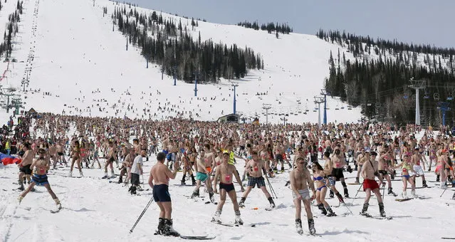 Snowboarders and skiers take part in a “downhill ski and snowboard descent in swimwear” event on Mount Zelyonaya (The Green Mount), at a ski resort near the town of Sheregesh in the Siberian Kemerovo region April 18, 2015. (Photo by Ilya Naymushin/Reuters)