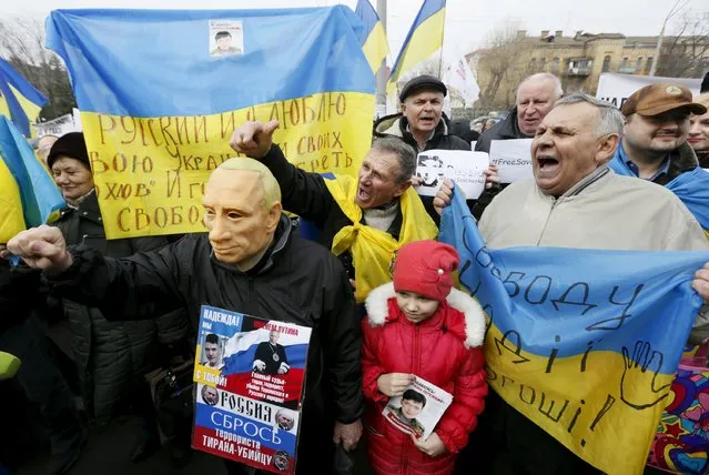 Protesters hold a rally in support of former Ukrainian army pilot Nadezhda Savchenko near the Russian embassy in Kiev, Ukraine, March 9, 2016. (Photo by Valentyn Ogirenko/Reuters)