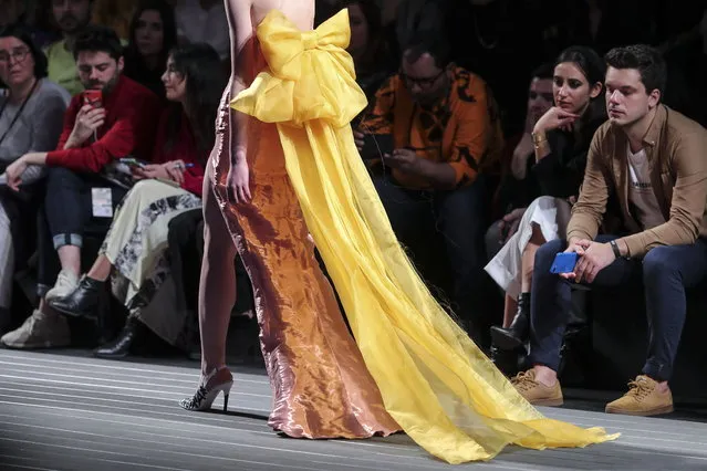 A model displays a creation by Portuguese designer David Ferreira on the second day of the Lisbon Fashion Week, at the Carlos Lopes Pavillion in Lisbon, Portugal, 09 March 2019. (Photo by Miguel A. Lopes/EPA/EFE)