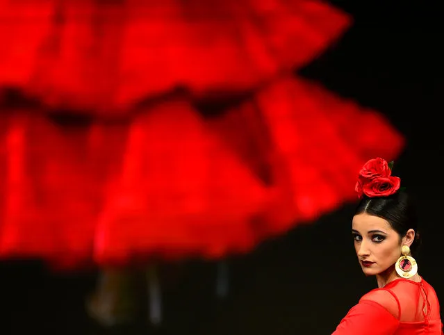 A model presents a creation by Pilar Vera during the SIMOF 2017 (International Flamenco Fashion) in Sevilla on February 2, 2017. (Photo by Cristina Quicler/AFP Photo)