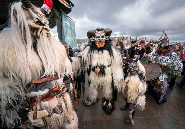 Participants during the Whitby Krampus Run street parade in Whitby, Yorkshire on Saturday, December 3, 2022, which celebrates the Krampus, a horned creature who accompanies Saint Nicholas on his rounds. (Photo by Danny Lawson/PA Images via Getty Images)