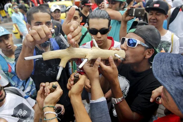 A man smokes marijuana during a demonstration in support of the legalization of marijuana in Medellin, May 2, 2015. (Photo by Fredy Builes/Reuters)