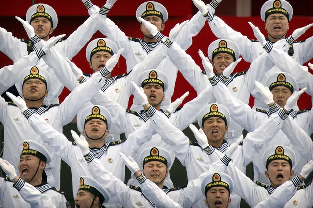 A Chinese navy chorus performs during a concert featuring Chinese and foreign military bands in Qingdao, Monday, April 22, 2019. Ships from Chinese and foreign navies have gathered in Qingdao for events this week, including a naval parade, to mark the 70th anniversary of the founding of the People's Liberation Army (PLA) Navy. (Photo by Mark Schiefelbein/AP Photo)