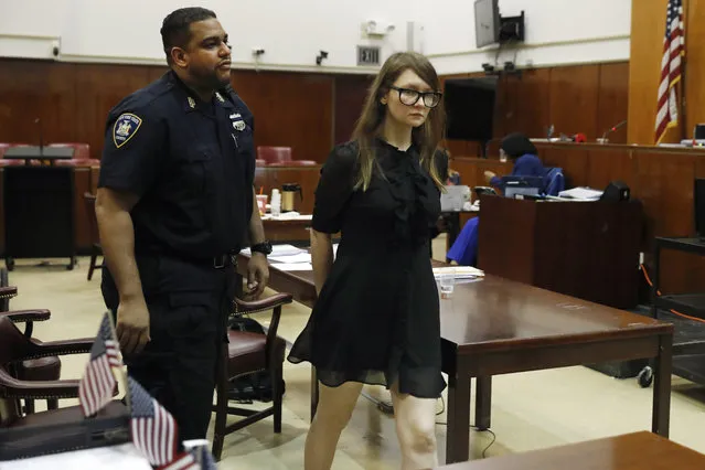 Anna Sorokin leaves the courtroom during jury deliberations in her trial at New York State Supreme Court, in New York, Thursday, April 25, 2019. Sorokin, who claimed to be a German heiress, is on trial on grand larceny and theft of services charges. (Photo by Richard Drew/AP Photo)