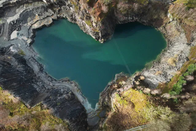 A hidden heart shape is revealed at the Elterwater Quarry in the Lake District after water levels dropped, exposing the romantic geographical feature filled with turquoise water caused by the chemical compounds in the 500-year-old volcanic rock. Picture date: Monday February 12, 2024. (Photo by Owen Humphreys/PA Images via Getty Images)