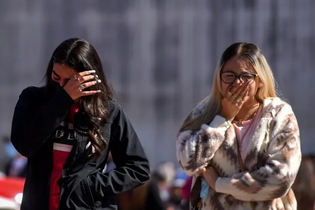 Mourners wipe their tears while leaving the funeral of Brianna Rodriguez, a concertgoer who died in a stampede during a Travis Scott performance at the 2021 Astroworld Festival, in Houston, Texas, U.S., November 13, 2021. (Photo by Callaghan O'Hare/Reuters)