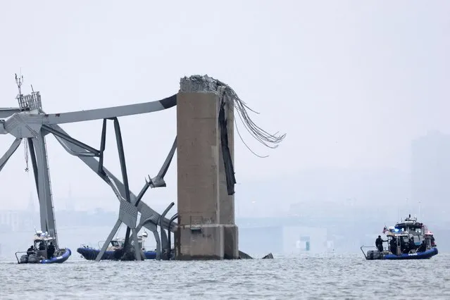 Emergency boats work near the collapsed section of the Francis Scott Key Bridge, after the Dali cargo vessel crashed into it, in Baltimore, Maryland, U.S., March 27, 2024. (Photo by Mike Segar/Reuters)