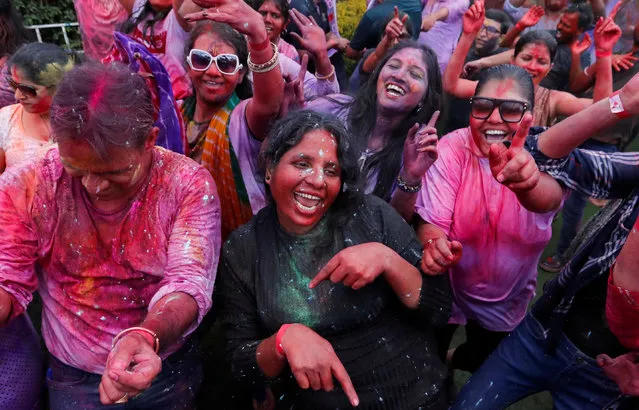 People daubed with color powders take part in the Hindu Holi Festival celebrated as the Festival of Colors, Love, and Spring in Nairobi, Kenya, on March 24, 2024. (Photo by Thomas Mukoya/Reuters)