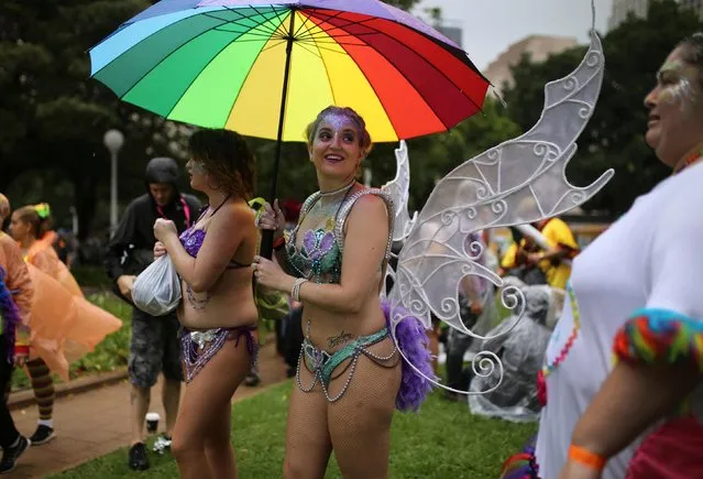 One festival-goer holds a rainbow umbrella during the annual Sydney Gay and Lesbian Mardi Gras festival in Sydney, Australia March 4, 2017. (Photo by Jason Reed/Reuters)