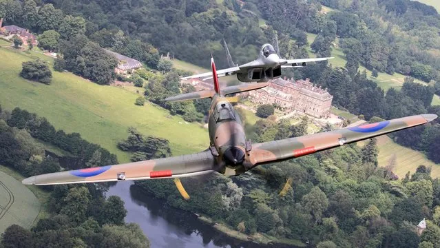 A Hawker Hurricane, its piot grinning as a Polish MiG-29 Fulcrum trails behind, is one of the memorable images captured by  UK armed forces photographers in 2018. (Photo by Cpl Tim Laurence)