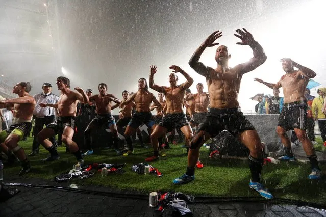 New Zealand's rugby team dance after winning the Hong Kong Sevens rugby tournament in Hong Kong, Sunday, March 30, 2014.  New Zealand defeated England in the final. (Photo by Kin Cheung/AP Photo)