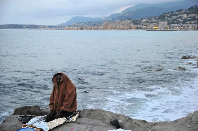 A migrant prays by the sea in Ventimiglia, at the Italian-French border, Tuesday, June 16, 2015. Police at Italy's Mediterranean border with France forcibly removed a few dozen African migrants who have been camping out for days in hopes of continuing their journeys farther north, a violent scene Italy is using to show that Europe needs to do something about the migrant crisis. (Luca Zennaro/ANSA via AP)