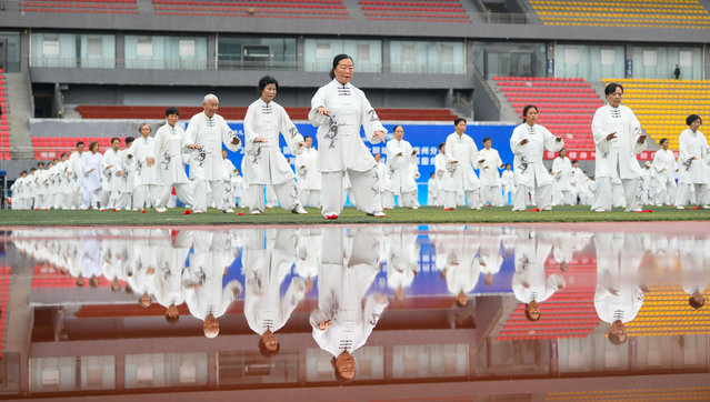 Tai Chi enthusiasts perform at Xingyi Sports Center on May 19, 2024 in Xingyi, Qianxinan Buyei and Miao Autonomous Prefecture, Guizhou Province of China. (Photo by Liu Chaofu/VCG via Getty Images)
