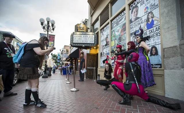 Cosplay enthusiasts wearing costumes pose for a photo during the 2015 Comic-Con International Convention in San Diego, California July 9, 2015. (Photo by Mario Anzuoni/Reuters)