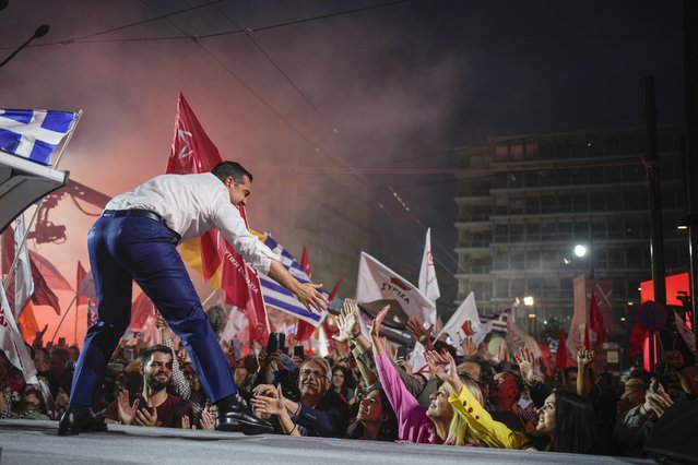 Leader of the main opposition Syriza party, Alexis Tsipras, shakes hands with his supporters during a pre-election rally, in Athens, on Thursday, May 18, 2023. Greeks go to the polls Sunday, May 21, in the first general election held since the country ended successive international bailout programs and strict surveillance period imposed by European leaders. Conservative Prime Minister Kyriakos Mitsotakis is seeking a second four-year term and is leading in opinions but may need a coalition partner to form the next government. (Photo by Thanassis Stavrakis/AP Photo)