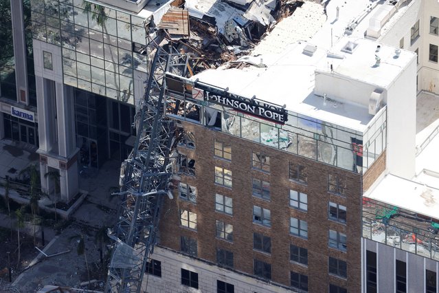 An aerial view of a collapsed crane on Tampa Bay Times building, in the aftermath of Hurricane Milton, in St. Petersburg, Florida, on October 10, 2024. (Photo by Marco Bello/Reuters)