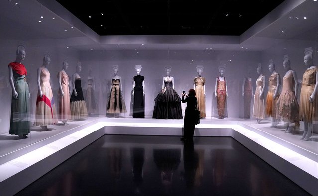 A person attends the media preview of the Costume Institute “Women Dressing Women” exhibit, at the Metropolitan Museum of Art in New York City on December 4, 2023. (Photo by Timothy A. Clary/AFP Photo)