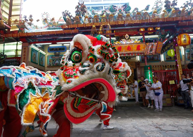 Dancers perform the Lion Dance to honor Chinese deities on the eve of the Vegetarian Festival at a Chinese shrine in Bangkok, Thailand, 02 October 2024. The Vegetarian Festival, also known as The Nine Emperor Gods Festival, is an annual Taoist celebration held during the ninth lunar month of the Chinese calendar, falling this year from 03 to 11 October. During the nine-day period, worshippers will abstain from consuming meat and will only consume vegetarian food and make merit, all aimed at cleansing their body and mind. (Photo by Rungroj Yongrit/EPA/EFE)