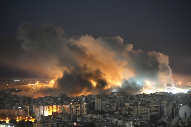 Flames and smoke rise form Israeli airstrikes on Dahiyeh, in the southern suburb of Beirut, Lebanon, Sunday, October 20, 2024. (Photo by Hussein Malla/AP Photo)